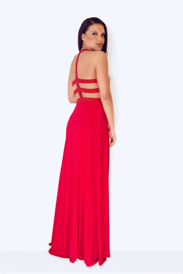 Back view of dynasty 1013015 prom dress in red on model.