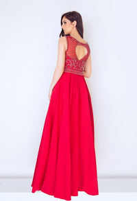 Back view of dynasty 1013032 prom dress in red on model.