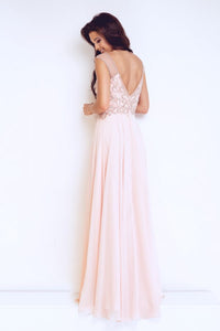 Back view of dynasty 1023102 prom dress in blush on model.